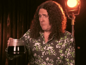 Animated GIF of Weird Al Yankovic throwing a pot of hot coffee on himself